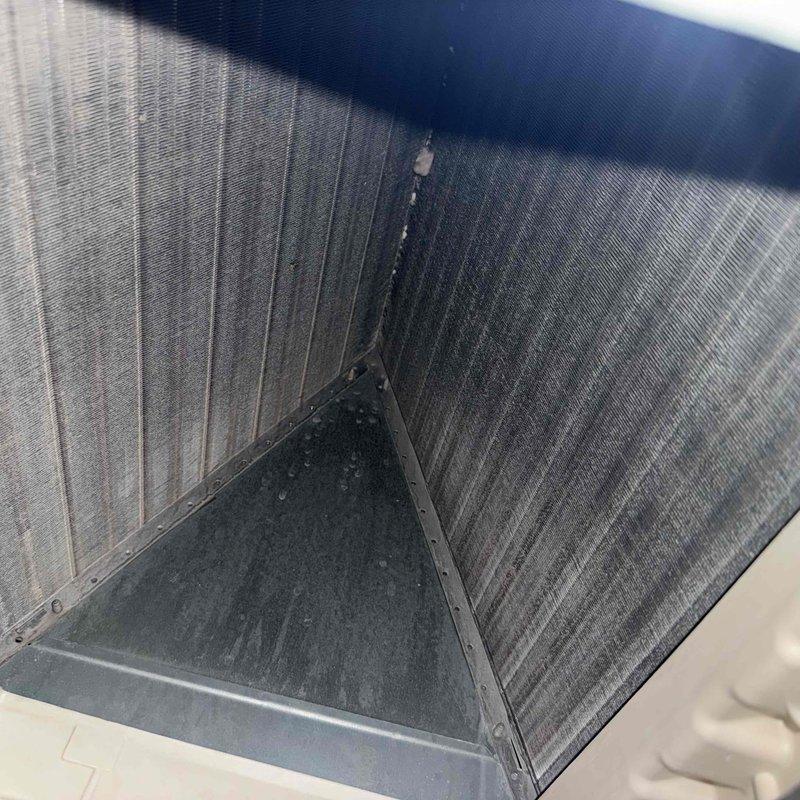 Responded to no cooling complaint on 10+ year old system with reported water leakage at air handler and saturated filter. Upon inspection, found evaporator coil drain pan collecting excessive condensate and clogged condensate drain line causing water backup into unit, which had saturated the air filter and restricted airflow. Verified contactor operation and electrical connections at air handler were secure. Cleared condensate drain blockage, replaced soaked air filter, and confirmed proper drainage from drain pan. System restored to normal cooling operation with proper airflow and no further water leakage observed.
