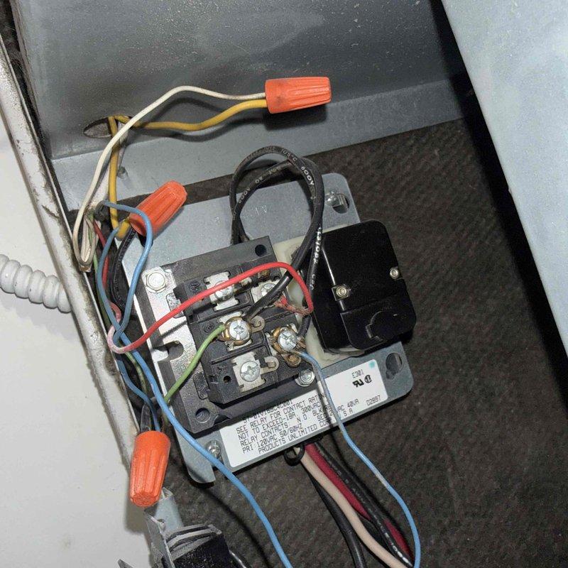 Responded to no cooling complaint on 10+ year old system with reported water leakage at air handler and saturated filter. Upon inspection, found evaporator coil drain pan collecting excessive condensate and clogged condensate drain line causing water backup into unit, which had saturated the air filter and restricted airflow. Verified contactor operation and electrical connections at air handler were secure. Cleared condensate drain blockage, replaced soaked air filter, and confirmed proper drainage from drain pan. System restored to normal cooling operation with proper airflow and no further water leakage observed.