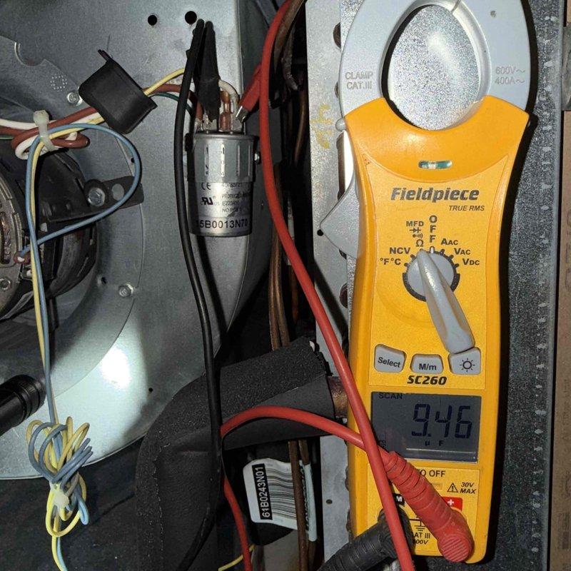 Completed comprehensive clean and check maintenance service on one heat pump system as part of annual comfort plan agreement. Performed electrical diagnostics including amp draw measurements showing 9.46 amps, inspected and tested dual run capacitor and contactor assembly, verified all electrical connections and wire terminations were secure, and confirmed proper system operation. All components found in good working condition with no deficiencies noted.
