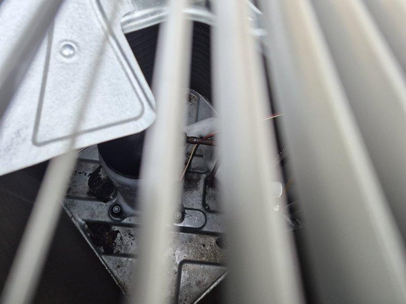 Responded to no cooling complaint on residential air conditioning system. Upon arrival, performed diagnostic evaluation of system operation, thermostat settings, and electrical connections. Inspected evaporator coil assembly and confirmed presence of moisture on coil fins, indicating proper refrigerant flow and system cycling. Verified all electrical connections at air handler were secure and properly terminated. Checked circuit breakers and confirmed power supply to unit. Clarified maintenance history regarding air filter service from previous fall visit, providing photographic documentation showing filter condition at time of last service. Discussed filter replacement protocol and membership coverage details. System found to be operational with no mechanical failures identified.