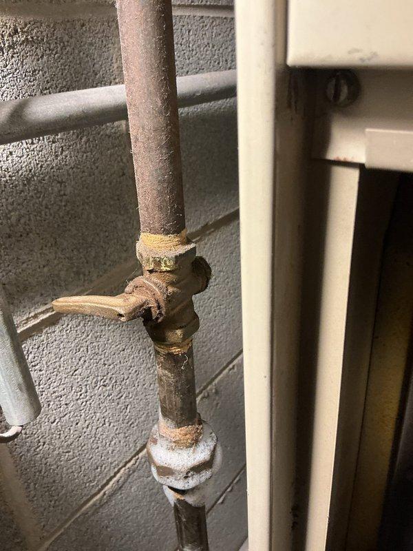 Responded to emergency gas leak at commercial property where utility company had restored service earlier in the day. Accessed unit using lockbox per provided instructions and located furnace with active gas leak at pilot light assembly. Inspected furnace equipment and gas piping system, documented corroded pipe connections and deteriorated valve fittings showing significant rust and mineral deposits. Shut off gas supply to furnace to eliminate immediate safety hazard and prevent further gas leakage until permanent repairs can be completed.