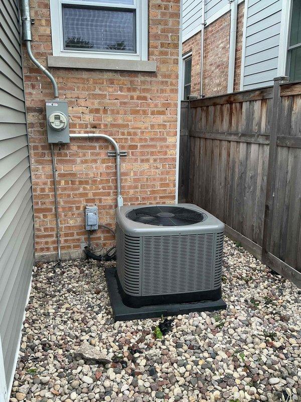 Responded to warranty call for water leakage around furnace, humidifier water panel replacement indicator, and metallic rattling noise from unit. Upon inspection, traced water source to condensate drain line issue and cleared blockage in PVC drainage system. Examined evaporator coil assembly and verified proper operation of condensate removal system. Inspected humidifier control panel and confirmed water panel requires replacement per maintenance indicator; advised customer of normal maintenance requirement. Investigated reported metallic rattling noise by examining blower assembly, heat exchanger area, and mechanical components within furnace cabinet. Identified loose mounting hardware on blower motor assembly causing vibration and noise; tightened all fasteners and verified secure mounting. Checked refrigerant lines and copper piping connections for proper support and insulation. Tested system operation through complete heating cycle to confirm resolution of all reported issues. Veri