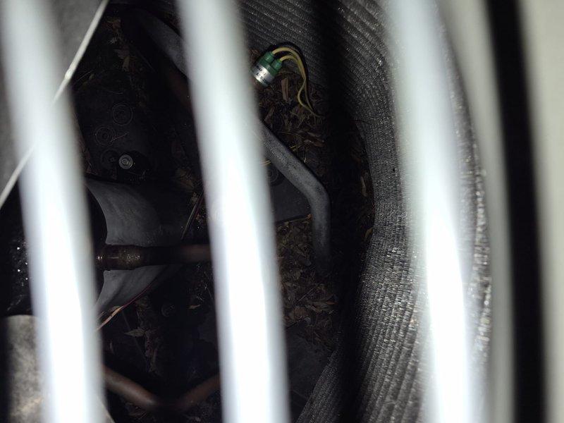 Responded to no-cool call on 12-year-old residential central air conditioning system affecting entire home. Upon arrival, performed diagnostic inspection of outdoor condensing unit and indoor air handler located in attic space. Tested electrical connections, verified power supply to unit, and checked capacitor function. Inspected refrigerant lines, coil condition, and ductwork connections. Documented system configuration with photos showing air handler installation, filter access, and mechanical components. Communicated findings with customer and provided recommendations for restoring cooling operation to the aging system.