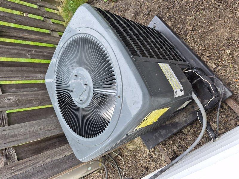 Completed comprehensive tune-up service on residential single-system air conditioning unit. Performed standard maintenance procedures including inspection of outdoor condensing unit with fan assembly and heat exchanger coils, as well as indoor air handler components including blower motor and electrical connections. All system components found operating within normal parameters; documented equipment condition with service photos showing outdoor condenser on wooden platform and indoor blower assembly with associated ductwork and wiring.