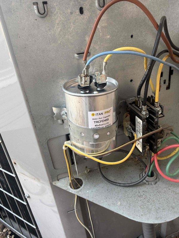 Responded to no cooling complaint on 2006 Carrier air conditioning system. Upon arrival, verified thermostat settings, filter condition, and electrical breakers. Performed diagnostic evaluation of outdoor condensing unit and indoor air handler. Inspected electrical components including contactor and TITAN PRO TRCFD455 capacitor for proper operation and connections. Documented equipment condition with photos of furnace/air handler installation and electrical control panel components. System age and previous service history noted during evaluation.