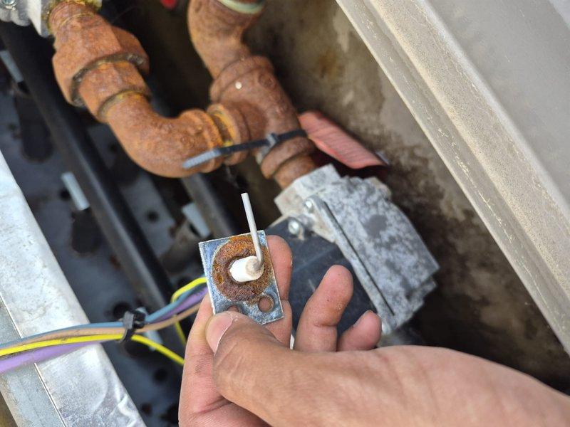 Completed commercial HVAC maintenance agreement service including RTU inspection, filter replacement, and documentation of equipment condition. Inspected boiler flue caps on roof for blockages and examined air handler components, noting oxidation on copper piping and corrosion on sensor components requiring monitoring. Unable to complete boiler firing tests and hanging heater inspections in electrical and cable rooms due to lack of building access; service will require rescheduling to complete full scope of preventive maintenance agreement requirements.