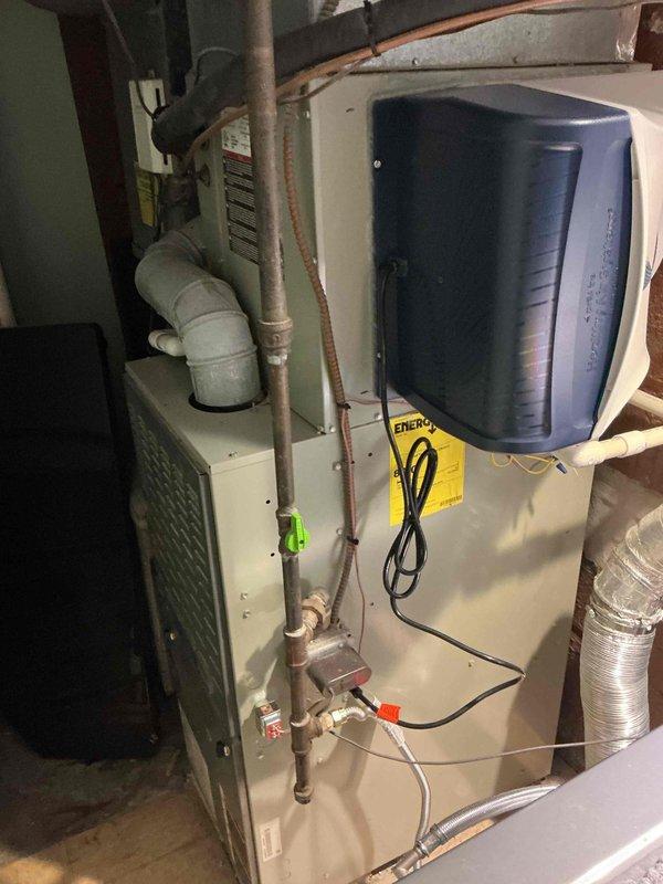 Completed full HVAC system replacement including furnace and air conditioning equipment. Reclaimed existing refrigerant from old A/C system per EPA regulations, then disconnected and properly disposed of existing forced air furnace, A/C condenser unit, and evaporator coil. Installed new SL280UH070V36A forced air furnace (Cat #78W67) and connected to existing supply and return air ductwork with necessary sheet metal transitions fabricated on-site. Connected furnace to existing gas line, electrical circuit, and exhaust venting. Installed new ML13KC1-024-230 A/C condensing unit (Cat #25C64) on new pad with pea gravel base to ensure proper leveling and drainage. Mounted new evaporator coil compatible with new system. Connected both units to existing copper refrigerant line-set. Performed complete system evacuation to remove all moisture and air, then charged system with R454B refrigerant to manufacturer specifications. Conducted full start-up procedures, tested all safety controls, verifie
