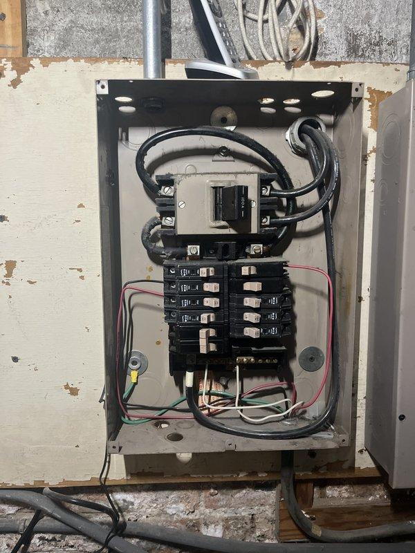 Conducted on-site assessment for first-floor mini-split installation in a two-flat building currently utilizing window AC units. Evaluated existing electrical panel capacity and infrastructure to determine compatibility with Mitsubishi mini-split system requirements, documented basement utility area conditions and available routing options for refrigerant lines and electrical connections.