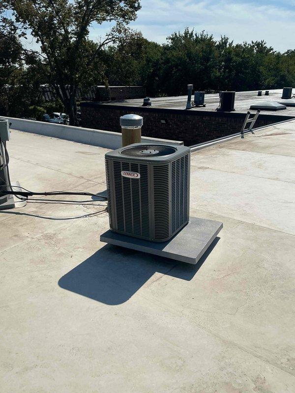 Completed commercial rooftop HVAC maintenance visit where the thermostatic expansion valve (TXV) was replaced on a Lennox air conditioning unit. After installing the replacement component, refrigerant recovery and evacuation procedures were performed using manifold gauges, recovery tank, and vacuum pump. System was recharged with refrigerant and pressures were verified to manufacturer specifications to ensure proper operation.