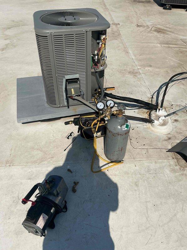Completed commercial rooftop HVAC maintenance visit where the thermostatic expansion valve (TXV) was replaced on a Lennox air conditioning unit. After installing the replacement component, refrigerant recovery and evacuation procedures were performed using manifold gauges, recovery tank, and vacuum pump. System was recharged with refrigerant and pressures were verified to manufacturer specifications to ensure proper operation.