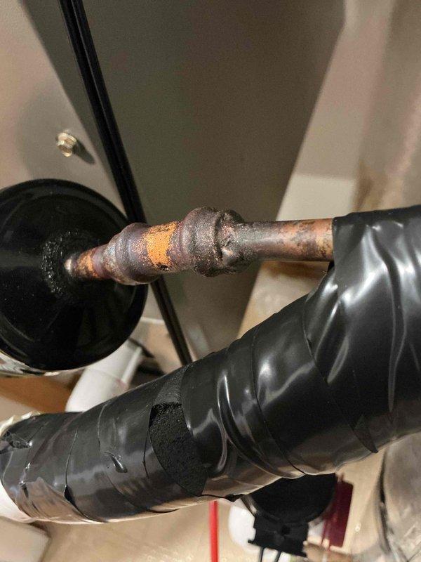 Responded to HVAC install callback for refrigerant leak at filter dryer connection. Upon inspection, discovered significant corrosion and deterioration at the welded joint of the filter dryer, confirming the leak location. Replaced the failed filter dryer assembly and repaired the corroded copper pipe connection. Recharged system with R-454B refrigerant to proper operating levels and performed leak test to verify repair integrity. System tested and confirmed operational with no further leaks detected.