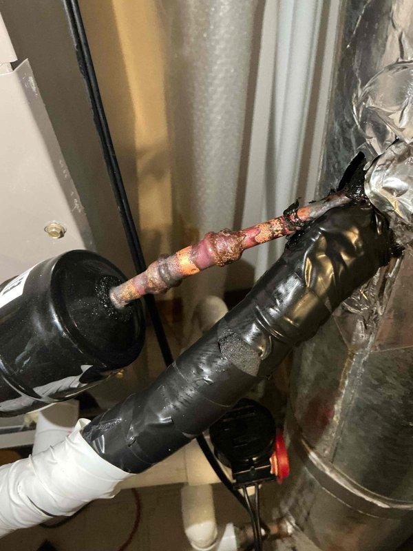 Responded to HVAC install callback for refrigerant leak at filter dryer connection. Upon inspection, discovered significant corrosion and deterioration at the welded joint of the filter dryer, confirming the leak location. Replaced the failed filter dryer assembly and repaired the corroded copper pipe connection. Recharged system with R-454B refrigerant to proper operating levels and performed leak test to verify repair integrity. System tested and confirmed operational with no further leaks detected.