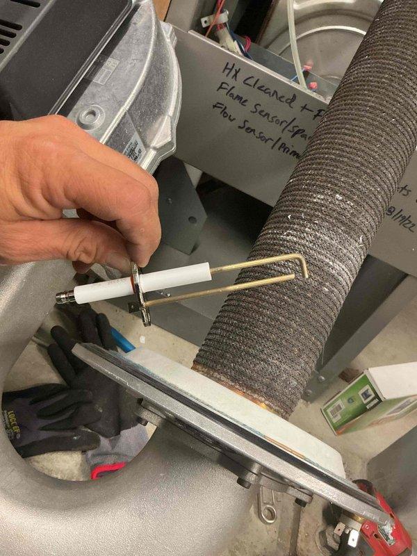 Performed comprehensive heat exchanger cleaning and flushing on Lochinvar commercial boiler system. Replaced flame sensor, spark electrode, and associated gaskets to ensure proper ignition and combustion operation. All components tested and verified operational upon completion of service.