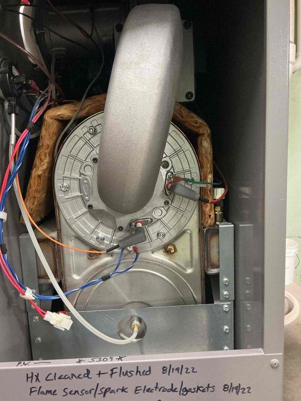 Performed comprehensive heat exchanger cleaning and flushing on Lochinvar commercial boiler system. Replaced flame sensor, spark electrode, and associated gaskets to ensure proper ignition and combustion operation. All components tested and verified operational upon completion of service.
