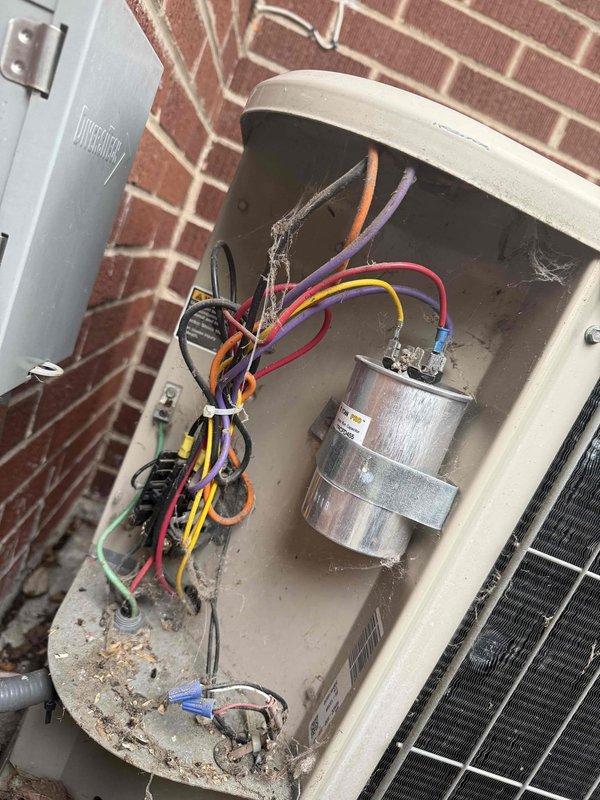 Responded to no cooling complaint on residential air conditioning system. Upon arrival, performed diagnostic evaluation of outdoor condensing unit and indoor air handler. Inspected electrical disconnect box, capacitor, and contactor assembly at outdoor unit. Verified thermostat settings, checked circuit breakers, and inspected air filter. Examined refrigerant line connections, ductwork configuration, and overall system operation. Documented equipment conditions with photographs of electrical components and indoor installation for service records.