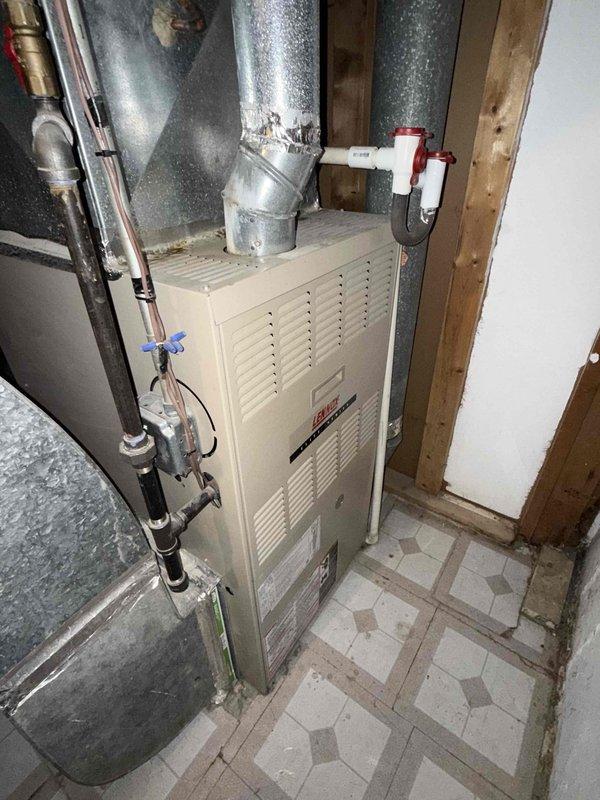 Responded to no cooling complaint on residential air conditioning system. Upon arrival, performed diagnostic evaluation of outdoor condensing unit and indoor air handler. Inspected electrical disconnect box, capacitor, and contactor assembly at outdoor unit. Verified thermostat settings, checked circuit breakers, and inspected air filter. Examined refrigerant line connections, ductwork configuration, and overall system operation. Documented equipment conditions with photographs of electrical components and indoor installation for service records.