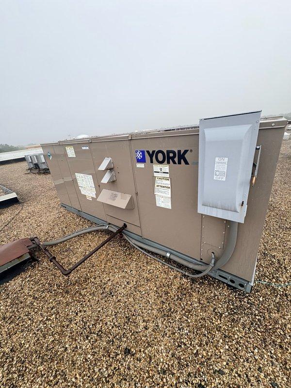 Arrived at commercial facility and coordinated building access for 8am start time. Replaced faulty sensor on York rooftop unit (RTU). Accessed unit control panel, removed defective sensor from existing wiring harness, and installed replacement sensor ensuring proper electrical connections. Verified all wire terminations were secure and tested unit operation to confirm sensor was reading correctly and system was functioning as designed. Collected outstanding balance on invoice and completed work order.