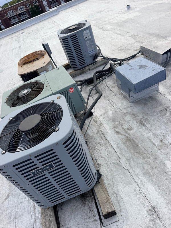 Responded to service call regarding missing refrigerant line insulation on roof-mounted AC condensing units. Conducted visual inspection of multiple rooftop units and confirmed that thermal insulation had been removed from refrigeration lines on numerous condensers. Documented existing conditions through photography, capturing current state of units, electrical connections, mounting platforms, and exposed refrigerant lines. Provided assessment that missing insulation compromises system efficiency, allows heat gain affecting cooling capacity, and may impact compressor longevity. Quoted material and labor for insulation replacement work to restore proper thermal protection to refrigerant lines.