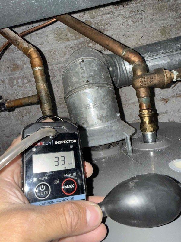 Completed comprehensive clean and check maintenance service on furnace, humidifier, and water heater per comfort plan agreement. Performed carbon monoxide testing with readings of 33 PPM documented at water heater location, and verified supply air temperature at 133.1°F at furnace discharge. All equipment inspected, cleaned, and operating within normal parameters with no safety concerns identified.