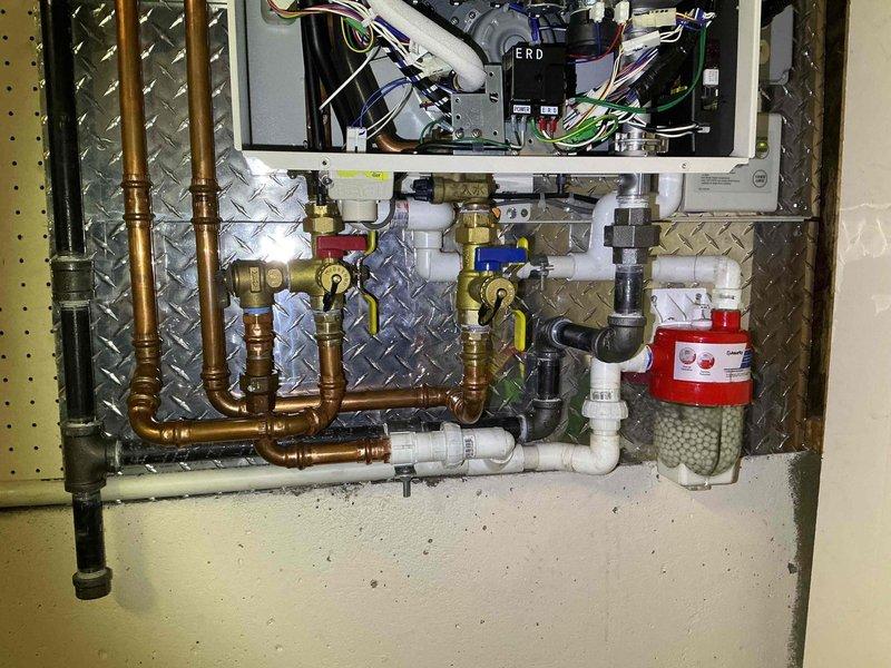 Performed annual maintenance and flush service on tankless water heater system installed in 2024. Completed comprehensive inspection of all components including manifold assembly, copper and PVC piping network, brass ball valves, filter housing, and heat exchanger fins. System verified to be operating properly with no issues identified; routine preventative maintenance completed as requested prior to customer travel.