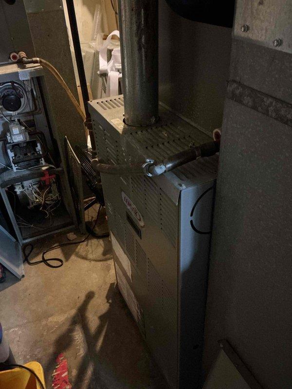 Completed spring preventive maintenance on commercial HVAC system per contract service agreement. Performed comprehensive system inspection including electrical diagnostics with clamp meter, recording amperage readings on furnace and associated equipment. Verified proper operation of heating unit and water heater, inspected all electrical connections, control panels, and wiring. Documented current equipment specifications and filter information for service records, noting any discrepancies requiring filter list updates. Captured detailed photographic documentation of equipment condition and system components for maintenance records.