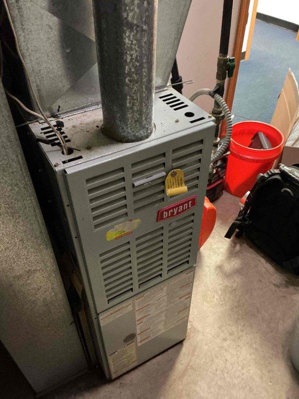 Completed spring preventive maintenance on Bryant gas furnace per commercial service agreement checklist. Confirmed tenant availability prior to arrival, performed comprehensive inspection of heating system including burner assembly, heat exchanger, blower components, and electrical connections. Documented current equipment model information and verified filter size as 16x25x1. Captured photographic documentation of unit condition and interior components. All systems operational upon completion of maintenance procedures.