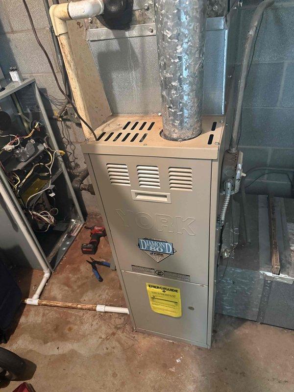 Completed spring preventative maintenance on York Diamond 80 furnace system per commercial service agreement checklist. Confirmed tenant availability prior to arrival, performed comprehensive system inspection, documented current equipment specifications and filter size information, replaced air filter, and captured photographic documentation of equipment condition and installation. All equipment information verified and updated for maintenance records.