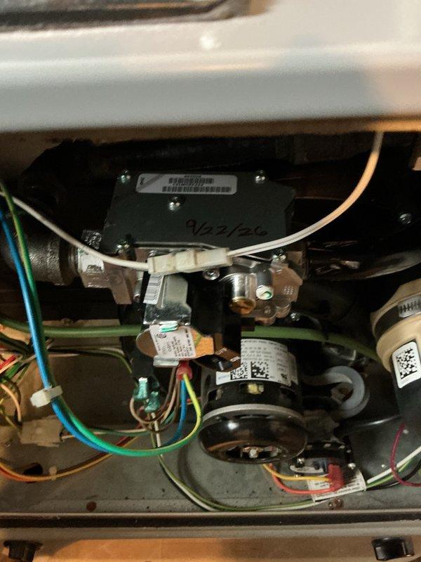 Replaced defective gas valve on residential furnace unit under warranty coverage. Accessed furnace interior, disconnected electrical connections and gas supply line from failed valve assembly, removed old component, and installed new gas valve with proper torque specifications. Reconnected gas piping with brass fittings, restored all electrical connections, and performed leak test on gas connections to verify system integrity. Cycled unit through complete heating operation to confirm proper ignition sequence and burner operation. All systems functioning normally upon completion.