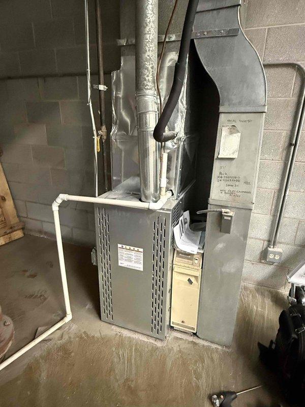 Completed commercial spring preventive maintenance on furnace unit per contract agreement. Performed comprehensive system inspection including visual equipment assessment, temperature diagnostics using infrared thermometer recording 98.2°F operational reading, and documented current equipment configuration with updated photographs. Verified all mechanical components, ductwork connections, and auxiliary systems operational within normal parameters.