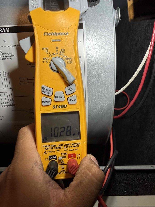 Completed fall maintenance tune-up on electric furnace/air handler system. Accessed electrical control panel and inspected all internal components including contactors, relays, and terminal connections. Performed electrical diagnostics using clamp meter, recording amperage draw of 10.28 amps to verify proper system operation. Inspected all field wiring, control board connections, and verified secure terminations throughout the panel. System tested and operating within normal parameters upon completion of preventative maintenance service.