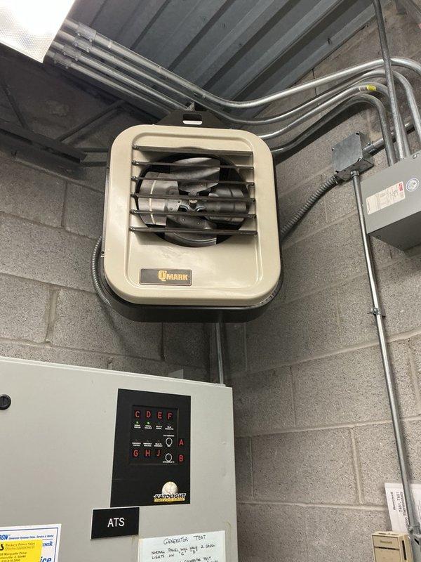 Responded to commercial facility for heater motor replacement in electrical room. Upon arrival, coordinated site access and proceeded to unit location. Removed and replaced defective motor assembly in ceiling-mounted QMARK unit heater with correct replacement motor. Verified proper electrical connections, tested unit operation, and confirmed heating functionality. Documented completed installation with photos showing proper motor mounting and wiring configuration.