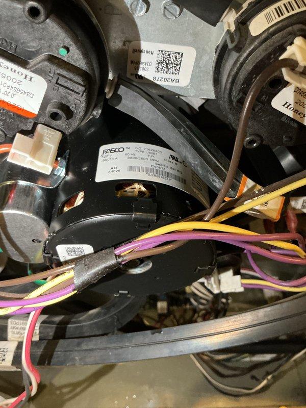 Replaced defective inducer motor under warranty with new FASCO unit retrieved from supplier. Removed failed motor assembly from furnace housing, disconnected all electrical connections, and installed replacement motor with proper wire routing and secure mounting. Verified all electrical connections were properly terminated and motor operated correctly upon system startup. Additionally completed water heater maintenance service as requested during same visit.