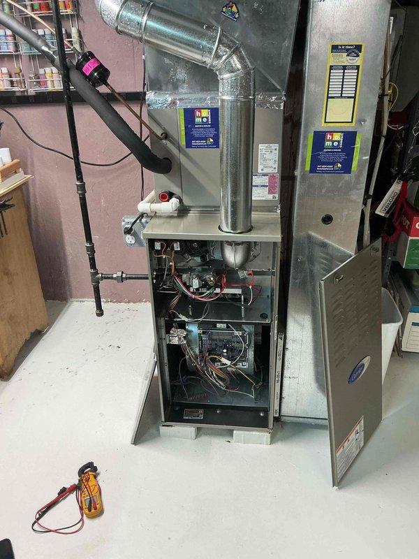Completed comprehensive clean and check maintenance service on residential heating system including furnace, humidifier, and tankless water heater per Gold Comfort Plan agreement. Performed full system inspection with all components operational, verified proper gas pressures, tested electrical connections and control boards, cleaned burner assembly, checked heat exchanger integrity, and confirmed proper venting and airflow. All equipment found in good working condition with no issues identified during service visit.