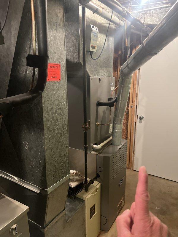 Conducted on-site evaluation of two existing furnace units for replacement estimate purposes. Documented current HVAC equipment in basement mechanical room, including aging furnace units at 25 and 30 years of service life. Photographed existing system components, ductwork configurations, and equipment specifications including manufacturer data plate showing R410A refrigerant system. Assessed installation conditions, clearances, and utility connections to provide accurate replacement recommendations for dual furnace system upgrade.