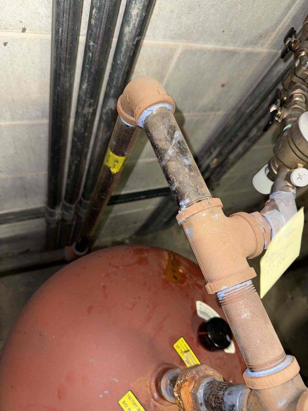 Completed fall preventative maintenance on commercial HVAC system including 2 boilers, 2 circulation pumps, and 1 RTU. Replaced 16x25x1 filters on rooftop unit per maintenance agreement specifications. Investigated reported leak on piping connected to expansion tank (pressure vessel) that was previously identified by plumbing contractor, documented conditions with photographs for further evaluation and repair recommendations.