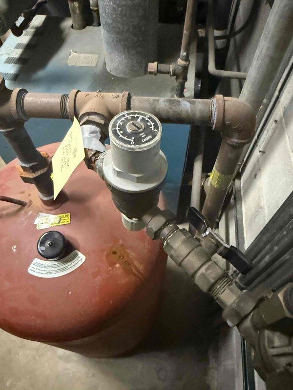 Completed fall preventative maintenance on commercial HVAC system including 2 boilers, 2 circulation pumps, and 1 RTU. Replaced 16x25x1 filters on rooftop unit per maintenance agreement specifications. Investigated reported leak on piping connected to expansion tank (pressure vessel) that was previously identified by plumbing contractor, documented conditions with photographs for further evaluation and repair recommendations.