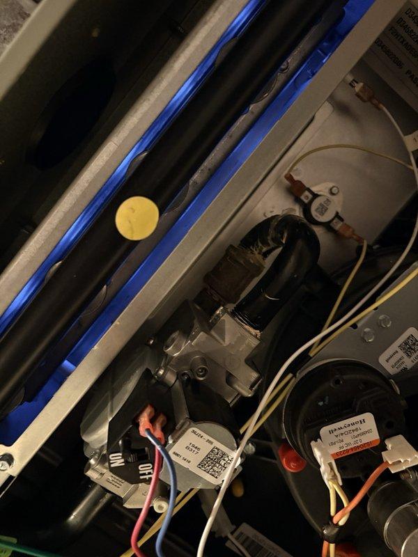 Completed comprehensive clean and check maintenance on heating system, humidifier, and water heater per Gold Comfort Plan agreement. Inspected and serviced Healthy Climate humidifier unit including water supply connections, verified proper operation of all mechanical components, and examined furnace internal components including gas valve assembly, pressure switches, and electrical connections. All systems tested and operating within manufacturer specifications.