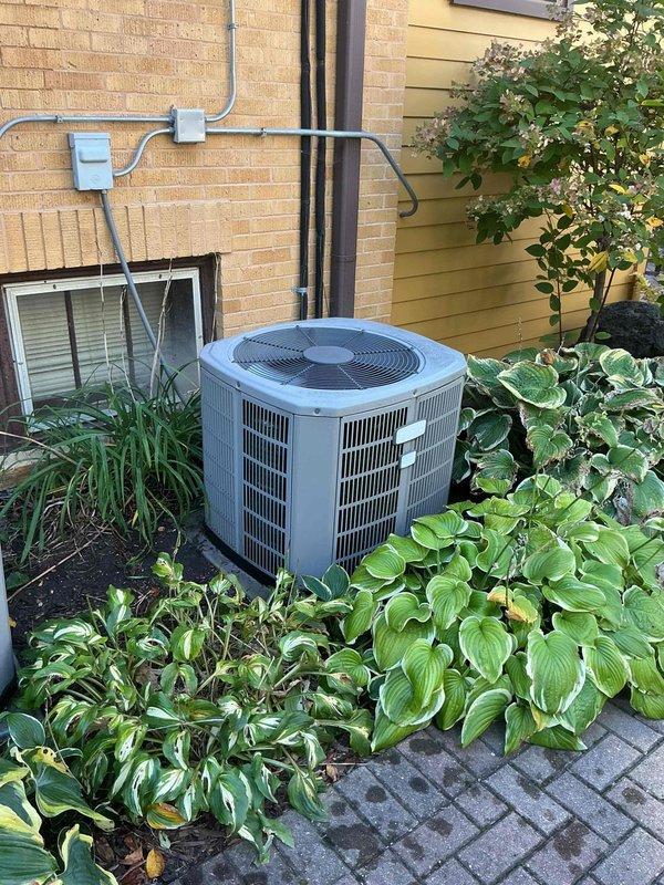 # HVAC Cooling System Repair

Responded to service call for one of two air conditioning units not operating at residential property. Unit is a 9-year-old system experiencing complete failure to cool.

## Diagnostic Findings

Upon arrival, performed visual inspection of outdoor condensing unit. System showed no signs of power to compressor or condenser fan motor. Removed access panel to electrical compartment and conducted voltage testing at contactor and capacitor terminals.

Identified failed dual-run capacitor as root cause of system failure. Capacitor tested at zero microfarads on both common-to-compressor and common-to-fan terminals, well below manufacturer specifications. Visual inspection of capacitor revealed bulging case and discoloration on terminal connections, indicating internal component failure.

## Repairs Performed

Disconnected power to unit at disconnect box. Safely discharged residual voltage from failed capacitor. Removed defective dual-run capacitor from mounting b