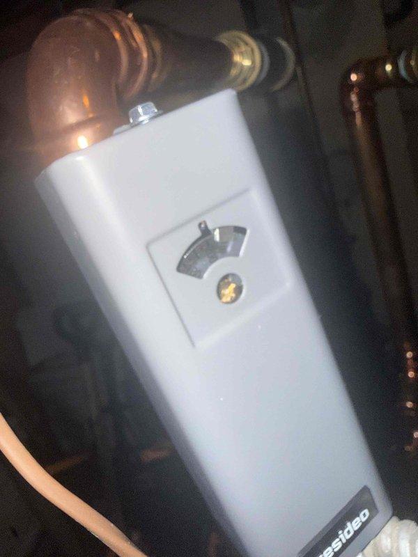 Replaced auxiliary high limit control on tankless water heater after picking up required part. Replaced failed O-ring on P-trap assembly to eliminate leak. System tested and verified operational upon completion.
