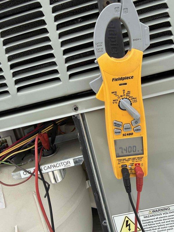 Completed fall commercial preventative maintenance on HVAC unit per contract specifications. Confirmed tenant availability prior to service, performed comprehensive checklist inspection including electrical measurements with clamp meter showing 7.108 amp draw, and conducted combustion analysis using Testo 310 II analyzer with readings of 365.0°F stack temperature, 100 ppm and 139 ppm gas measurements. Inspected capacitor, wiring harness, and internal components through access panel. Documented equipment information and filter specifications for records, noting corroded copper piping that may require future attention. Updated equipment data and flagged necessary filter list changes for system tracking.