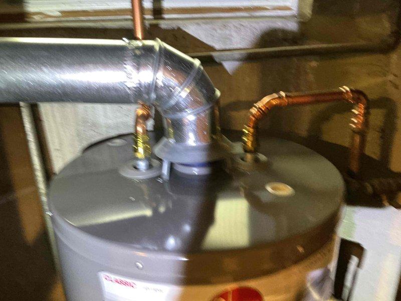 Completed comprehensive fall maintenance inspection including furnace clean and check, humidifier service, and water heater inspection per comfort plan protocol. All equipment operating within manufacturer specifications with no immediate concerns identified. Documentation photos captured showing water heater installation and drain pan condition for maintenance records.