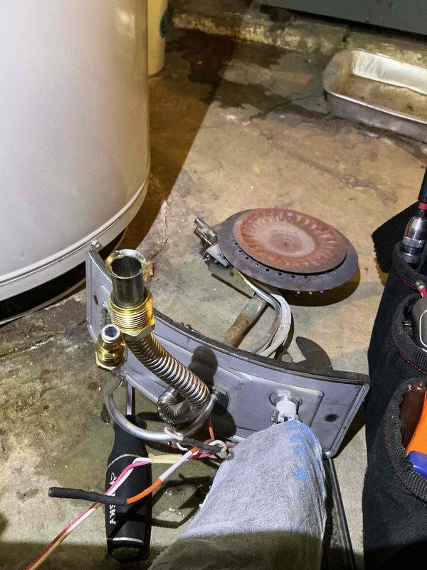 Completed comprehensive clean and check maintenance service on three heating systems per comfort plan agreement: boiler, water heater, and wall furnace. Performed thorough inspection of wall furnace burner assembly, removing and examining the radial port burner disc, gas valve connections, and ignition components. Cleaned burner surfaces, verified proper gas flow through brass fittings and flexible connector, tested electrical connections and safety controls, and reassembled unit to manufacturer specifications. Inspected boiler and water heater systems for proper operation, safety compliance, and efficiency. All systems tested and confirmed operational with no deficiencies noted. Documentation completed with photographic records of equipment condition.