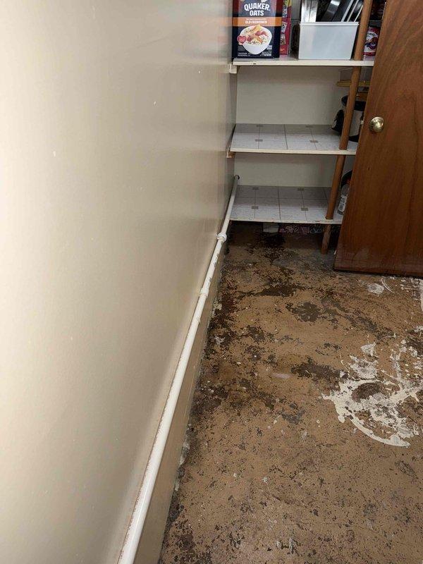 Responded to water damage incident affecting interior flooring and plumbing system. Removed existing CPVC piping that had failed and caused flooding in storage area. Installed new 3/4" PVC pipe as replacement, ensuring proper routing through ceiling penetration. Addressed compromised pipe installation that resulted in significant water intrusion and floor damage. Completed plumbing repair to restore system integrity and prevent further water damage.