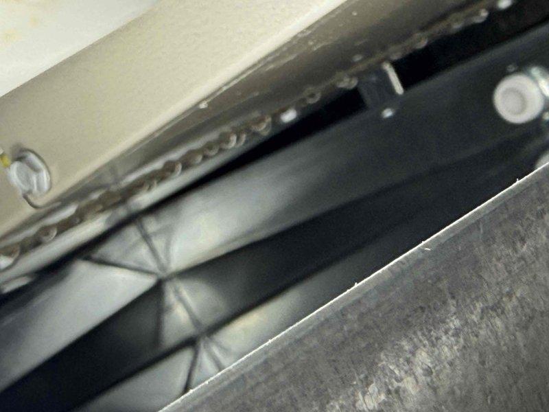 Responded to service call at commercial dance studio for HVAC unit running with minimal airflow and frozen coils. Upon inspection, utilized digital diagnostic meter to assess system performance and refrigerant levels, recording reading of 490R. Examined evaporator coil assembly and ductwork connections in mechanical compartment. System was recently installed this year, requiring thorough evaluation to determine if issue was installation-related or caused by other factors. Documented equipment condition with photos showing measurement readings and component configuration for warranty consideration and follow-up analysis.