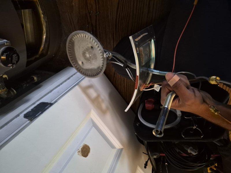 Performed Comfort Plan clean and check on the furnace and water heater, removing and inspecting the gas burner assembly and cleaning accumulated dust and deposits from the burner head to restore proper combustion. Verified safe operation with a carbon monoxide analyzer, which read 0 PPM, and confirmed the system operating normally at completion.
