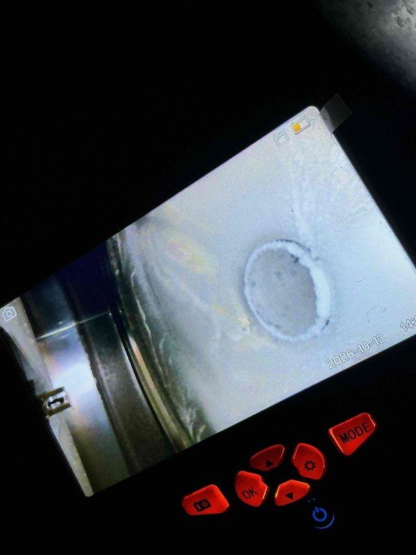 Performed a fall clean and check on the furnace, humidifier, and water heater per the comfort plan, including inspection of components and operation. Borescope inspection of the heat exchanger revealed heavy frost/ice buildup and discoloration around the openings, indicating a potential combustion venting or condensate-related issue; the condition was documented with photos and further evaluation or repair is recommended.
