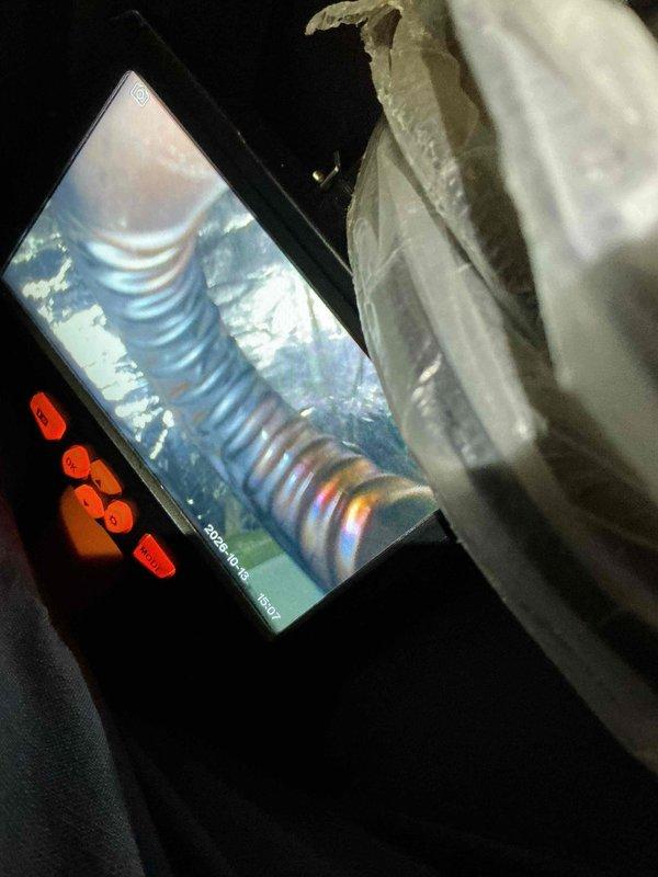 Performed a tune-up on one furnace system, including a borescope inspection of the flexible ductwork and interior components to check for damage, restrictions, and wear. Measured supply air temperature with a digital thermometer, recording 112.6°F at the ductwork, and noted heavy corrosion on an adjacent iron pipe along with dust and cobweb buildup in the mechanical area.
