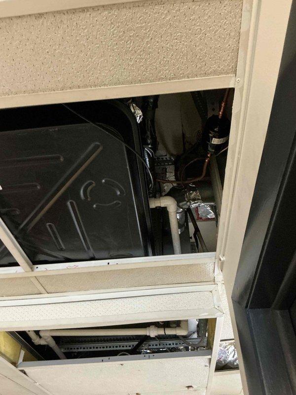 Returned with install team to cap off the supply vent on the Goodman system and sealed air leaks on both the Goodman and Payne systems. On the Payne system, installed a new drain pan sized to fully cover the evaporator coil, relocated the furnace shutoff switch, extended the PVC condensate drain, and rechecked system pressures to verify proper operation.