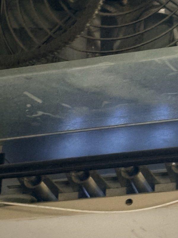 Performed fall preventive maintenance on a suspended gas-fired unit heater, completing the maintenance checklist and inspecting the fan assembly, burner tubes, heat exchanger surface, and gas piping connections. Documented updated equipment and filter information and flagged changes needed to update the filter list, with no frost, rust, or conspicuous damage observed on the unit.