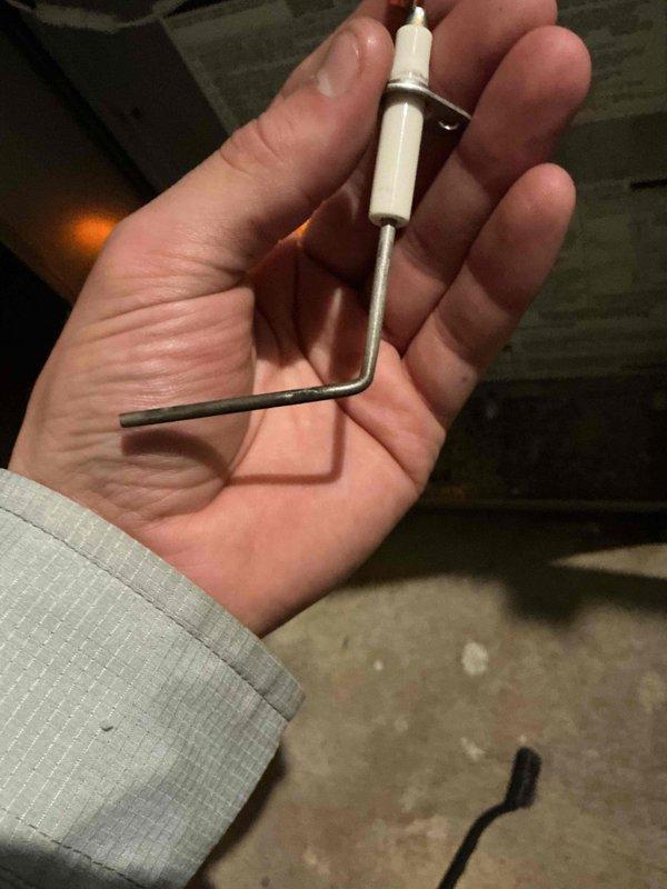 Performed scheduled prepaid commercial maintenance on the furnace/air handler, including inspection of the air filter and flame sensor assembly. Replaced the air filter with a new pleated unit, noting filter size and equipment information for the filter list update. Removed and inspected the flame sensor, which showed dull, tarnished buildup along the rod, and serviced it to support reliable ignition and flame proving.